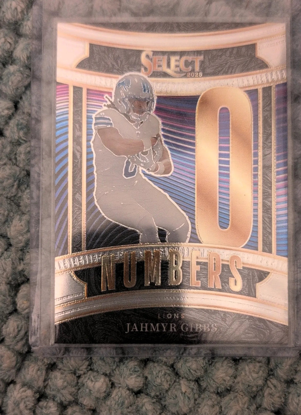 2025 Panini Select Jahmyr Gibbs #6 Numbers Insert - Front