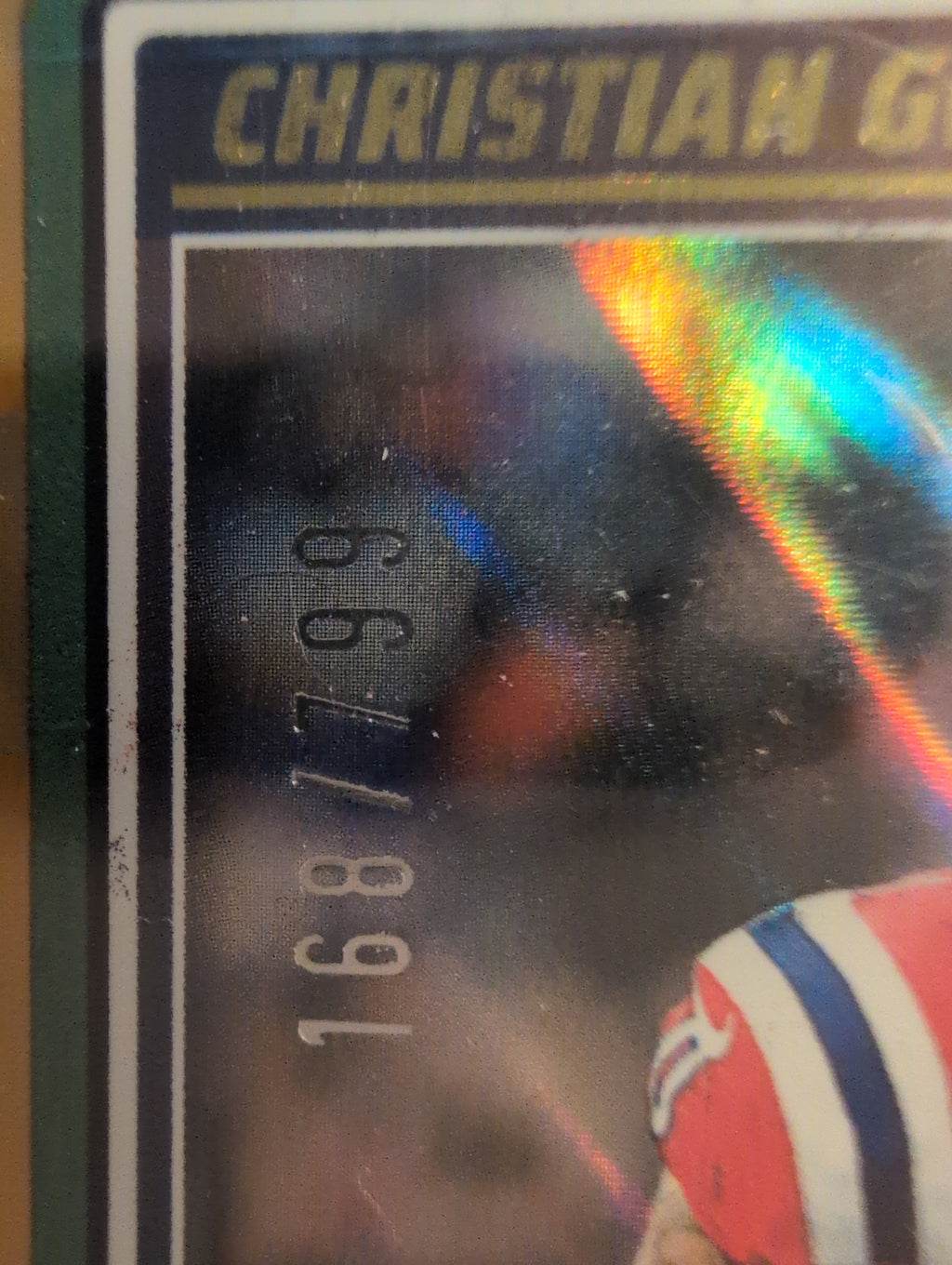 Serial number close-up showing Christian Gonzalez card numbered 168/799