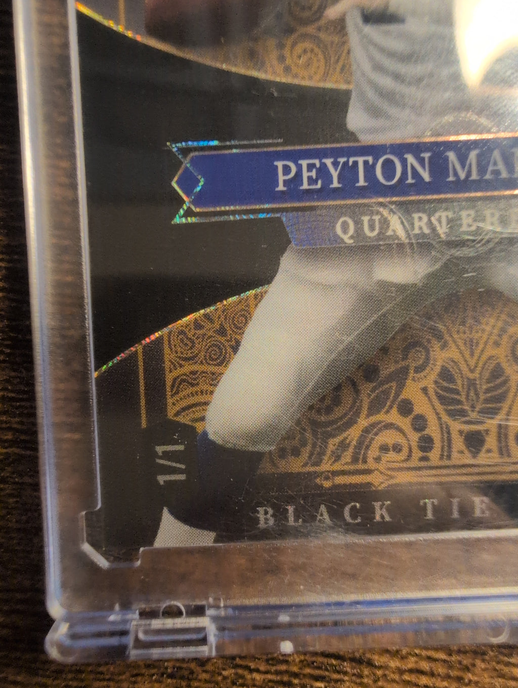 Close-up of Peyton Manning Black Tie Edition 1/1 serial stamp