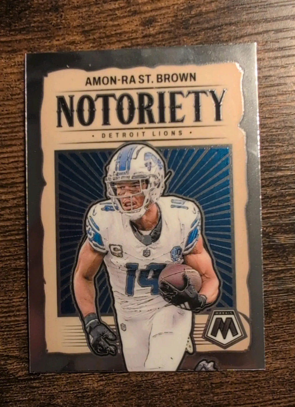 2024 Panini Mosaic Amon-Ra St. Brown Notoriety #12